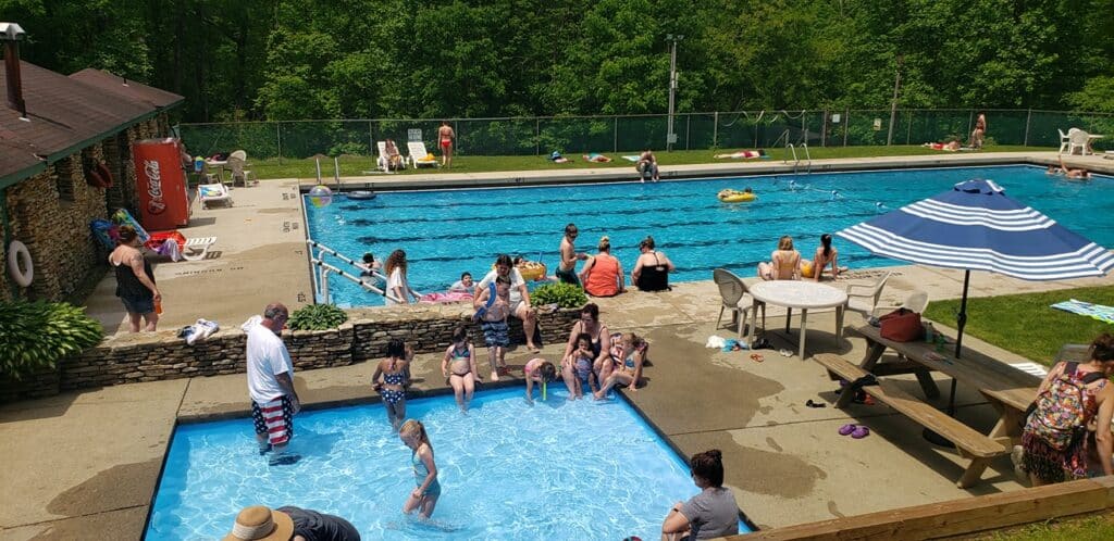 A group of people at a swimming pool.