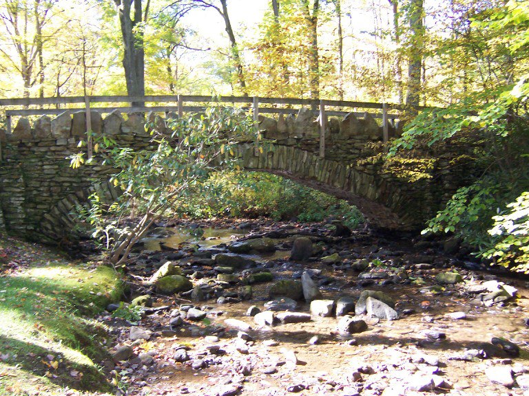 A stone bridge over a stream.